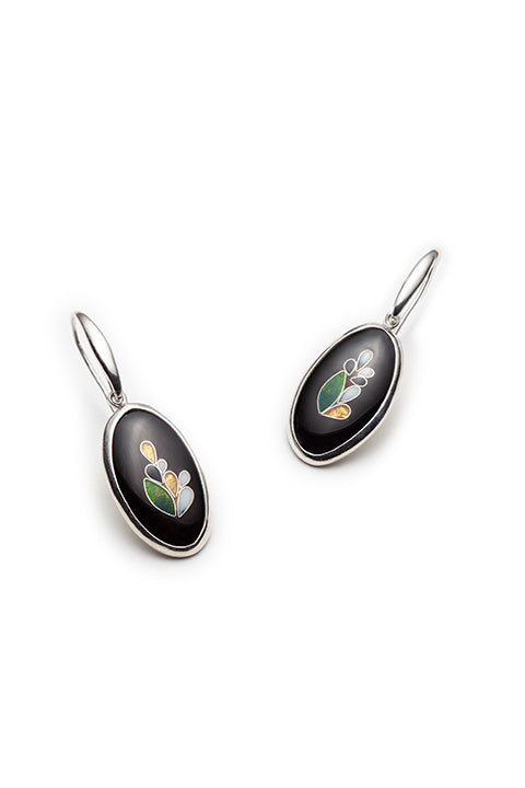 Black oval earrings with floral designs